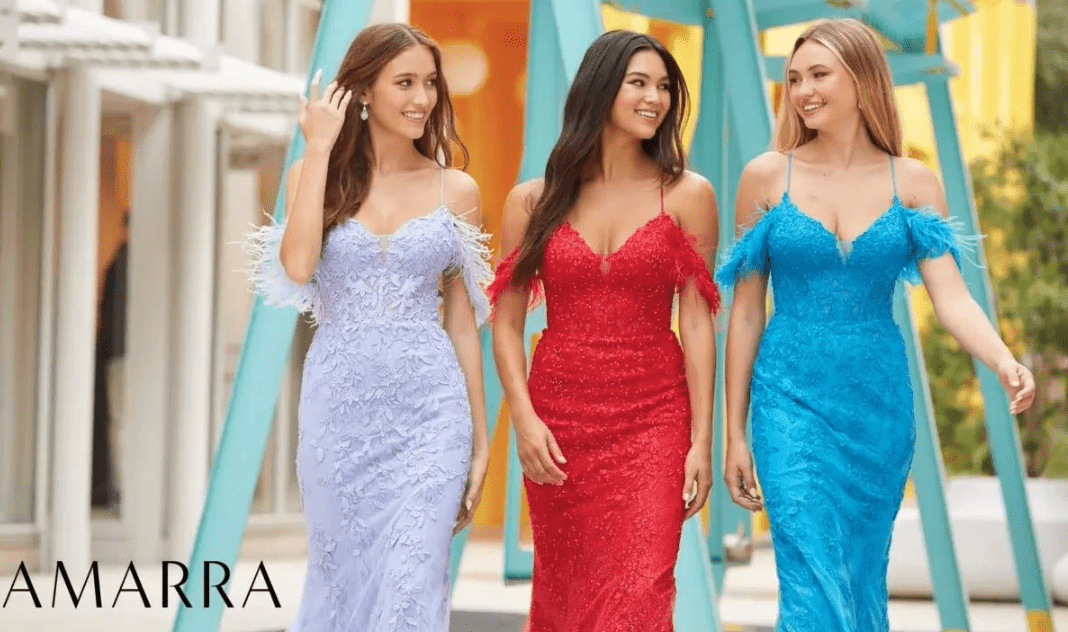 Three models walking outdoors in lace gowns with feather sleeves, in lilac, red and turquoise