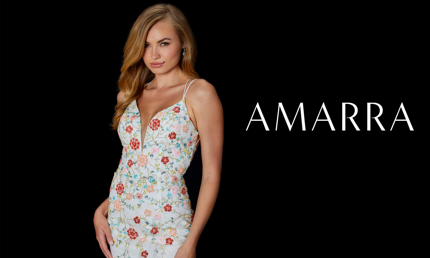 Amarra banner with model in ivory floral-embroidered fitted dress on black background