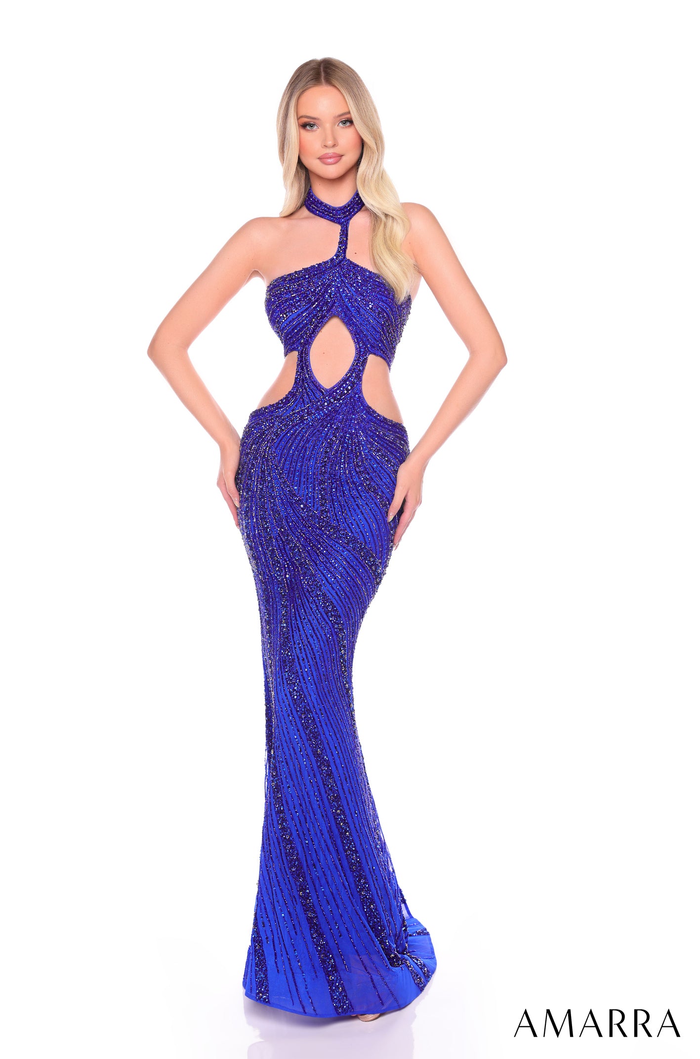 A form-fitting, floor-length gown in Bright Royal blue with sparkling embellishments and cutout details.