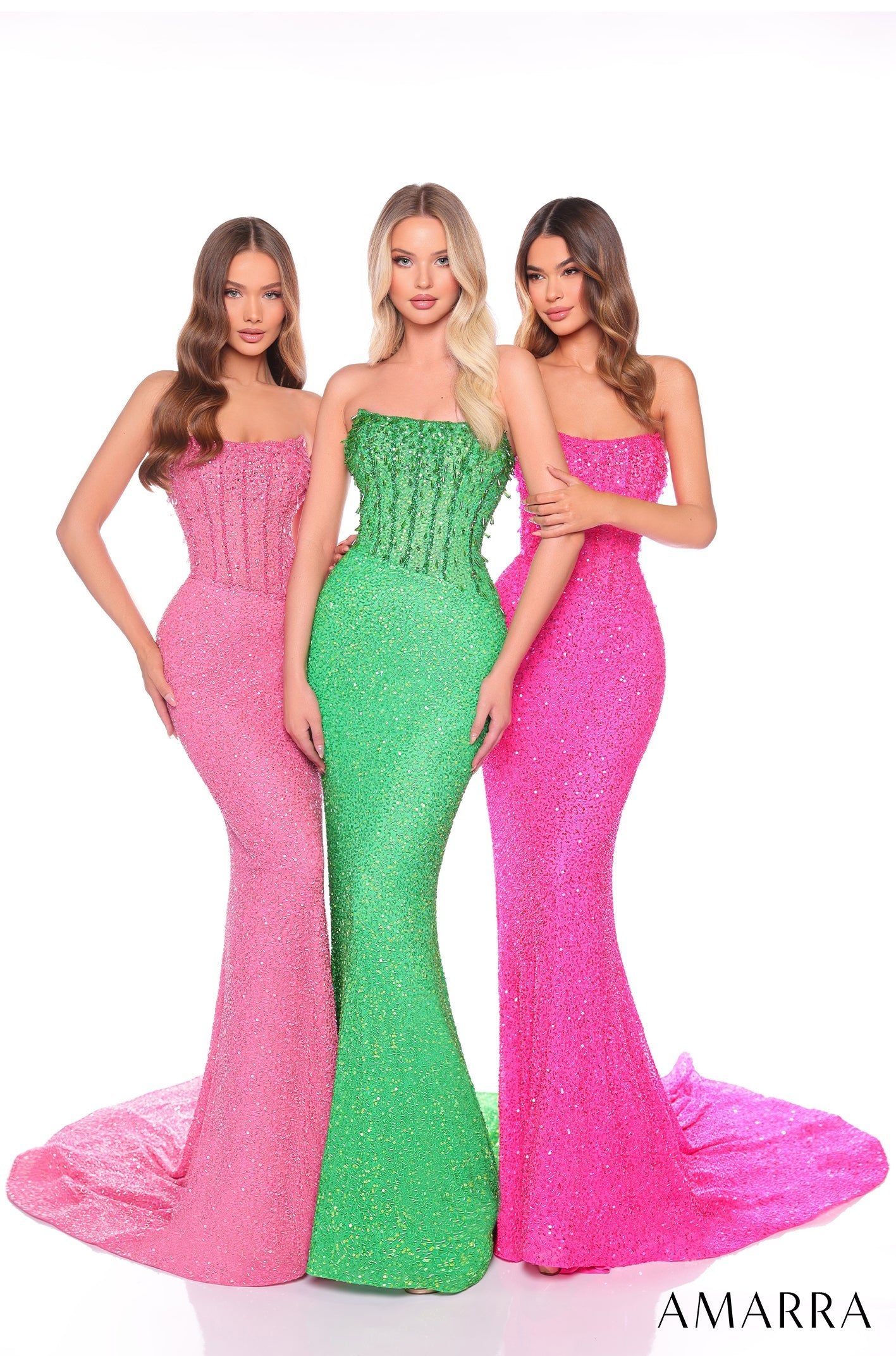 Three models wear sparkling strapless mermaid gowns in pink and green for Amarra's glamorous evening collection.