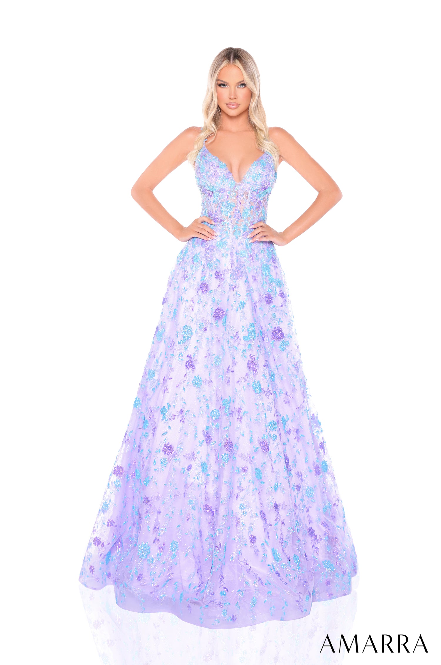 A floor-length ballgown in Lilac/Light Blue with floral embellishments and a fitted bodice, styled on a model.