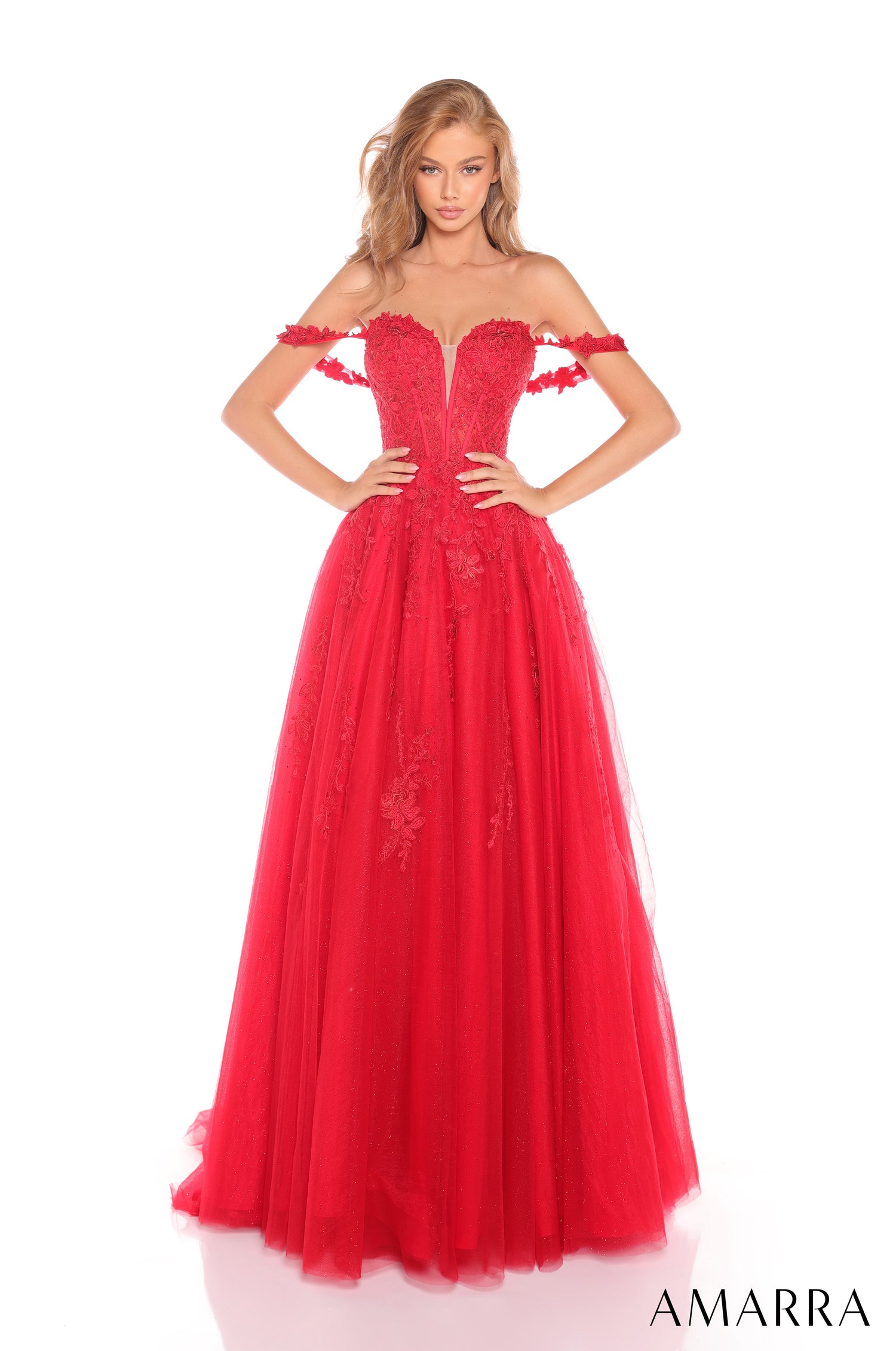 A model wears a floor-length, off-shoulder Red ball gown with floral lace bodice and tulle skirt.