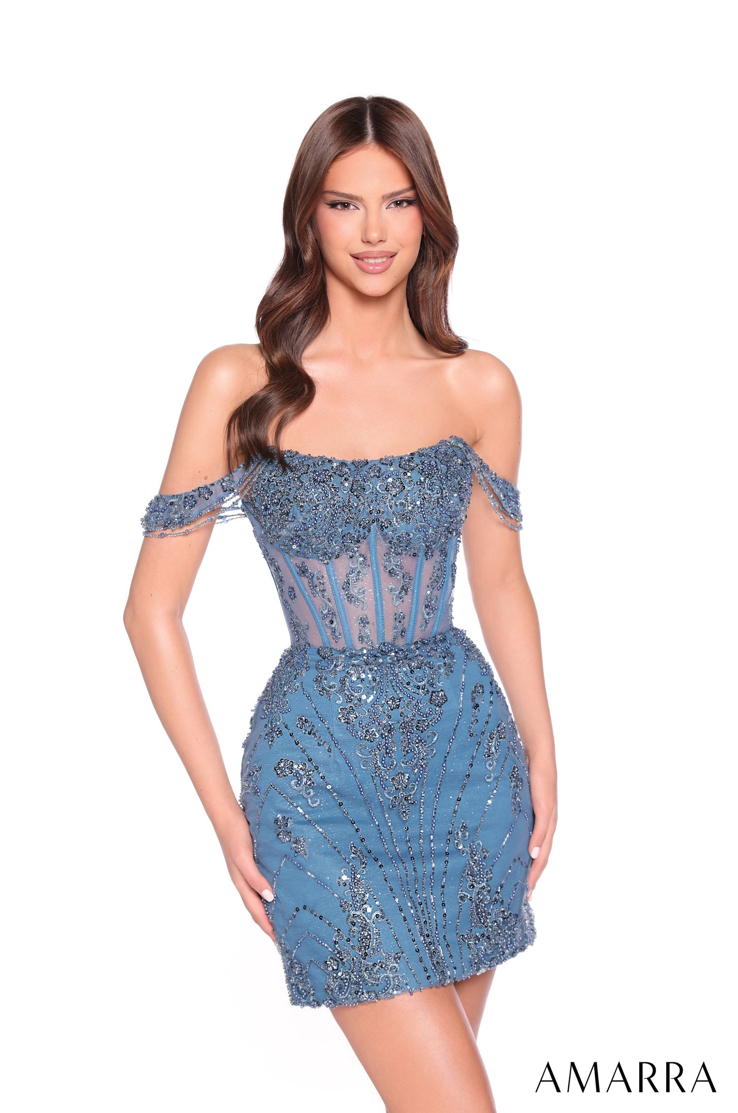 A model wears a short, teal sequined off-shoulder dress with intricate beaded details and a fitted silhouette.