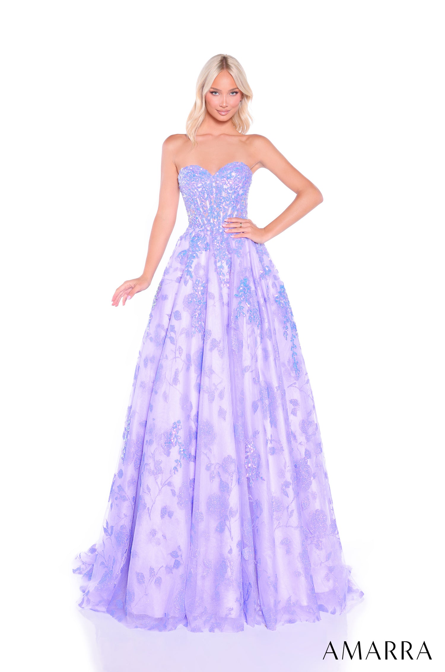 A blonde model wears a strapless lilac ballgown with shimmering sequins and a full, flowing skirt.