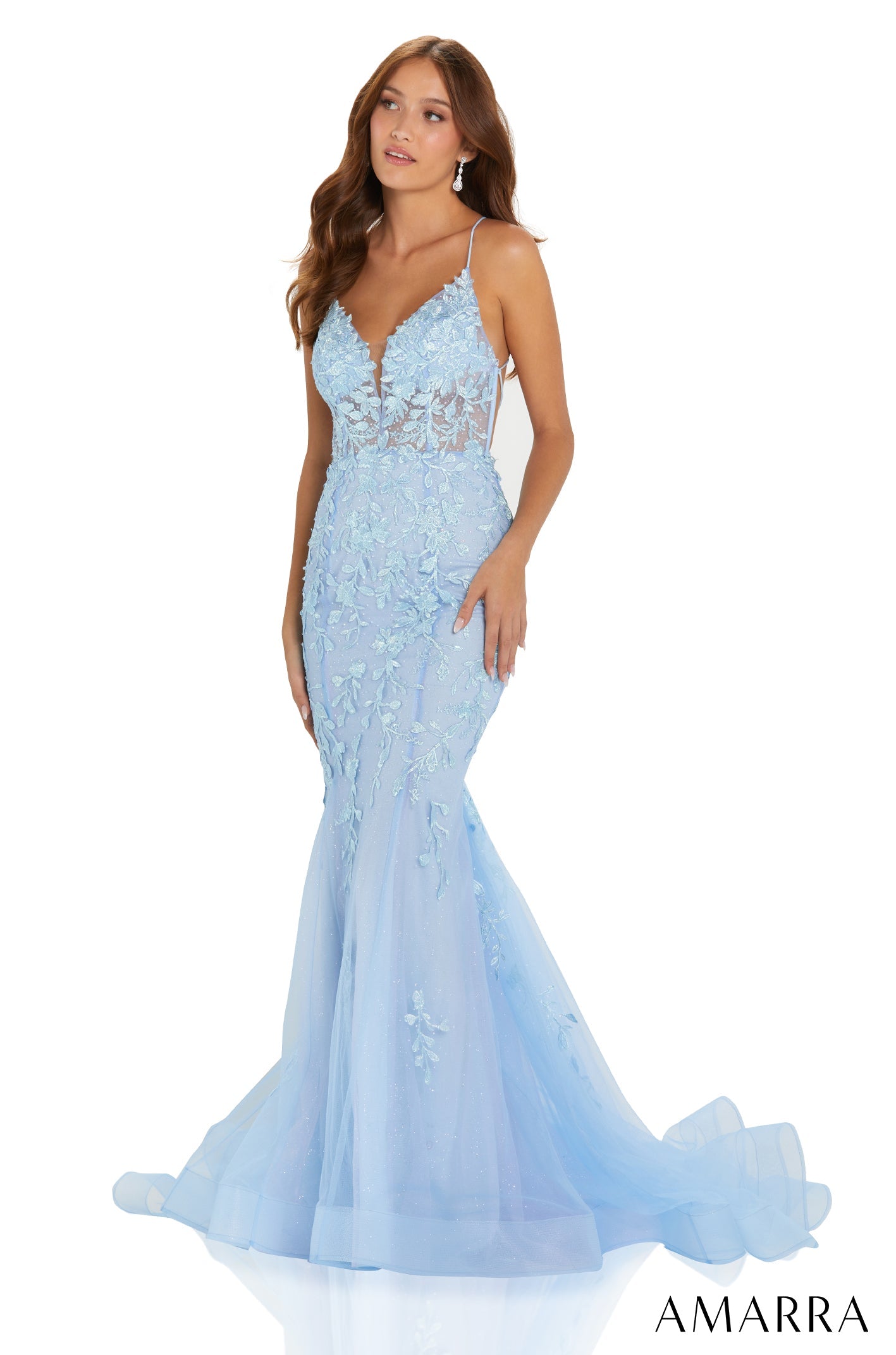 A pale blue lace mermaid gown with spaghetti straps and a flowing tulle skirt.