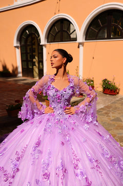 A woman in a lavender 3D floral ballgown poses confidently against an arched yellow building backdrop.