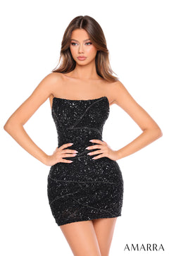 A woman wears a strapless, Black sequin mini dress that hugs her curves, posed against a white background.