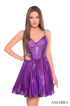 A woman stands wearing a knee-length Purple pleated metallic cocktail dress with a structured bodice.