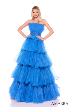 A strapless, tiered peacock blue ballgown with a ruffled skirt and embellished waistband by Amarra.