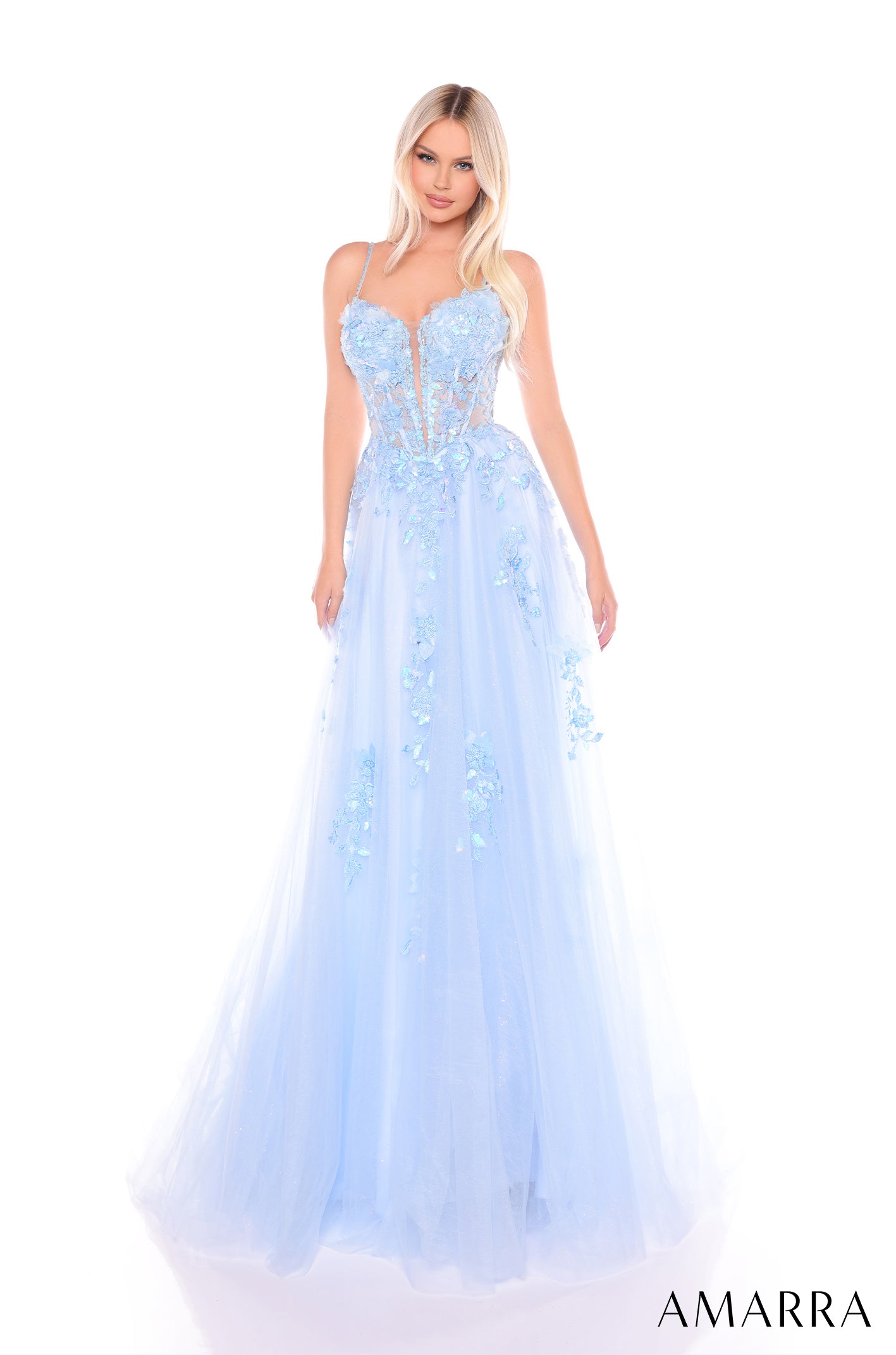 A floor-length, light blue corset gown with floral appliqués and a full tulle skirt.