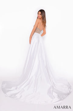 A model wears a white satin wedding gown with a beaded bodice and long train against a white background.