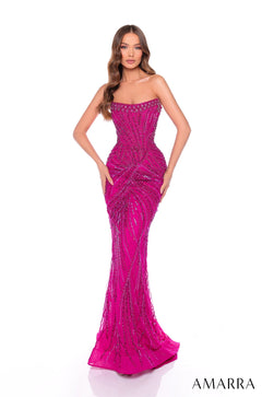 A strapless hot pink sequin mermaid gown with intricate beaded geometric patterns that hug the body's curves.
