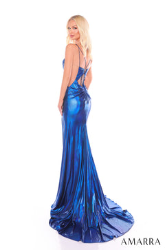 A blonde model wears a shimmering royal blue metallic mermaid-style evening gown with a long train.