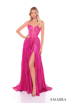 A model wears a fuchsia floor-length gown with a sequined bodice, plunging neckline, and high leg slit.