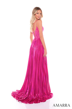 A model wears a long, hot pink sequined gown with a pleated skirt and criss-cross back straps.
