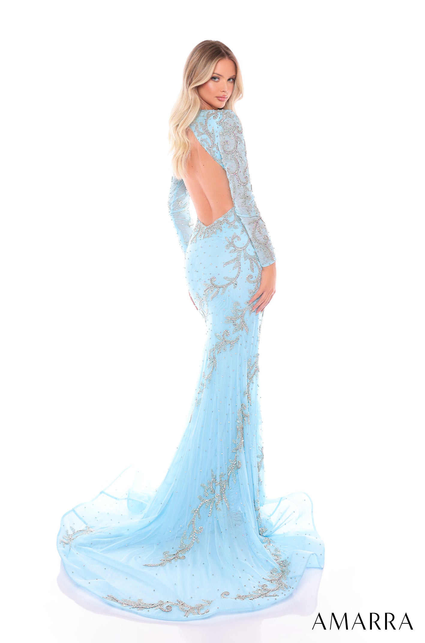 A light blue, floor-length gown with silver embellishments and an open back, designed by Amarra.