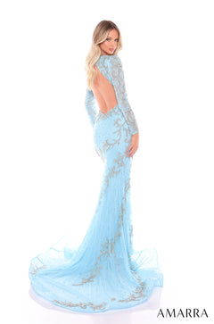 A light blue, floor-length gown with silver embellishments and an open back, designed by Amarra.