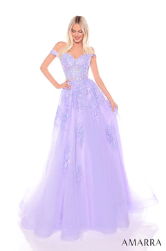 A woman wears a voluminous lilac off-shoulder ball gown with sparkling floral embellishments.