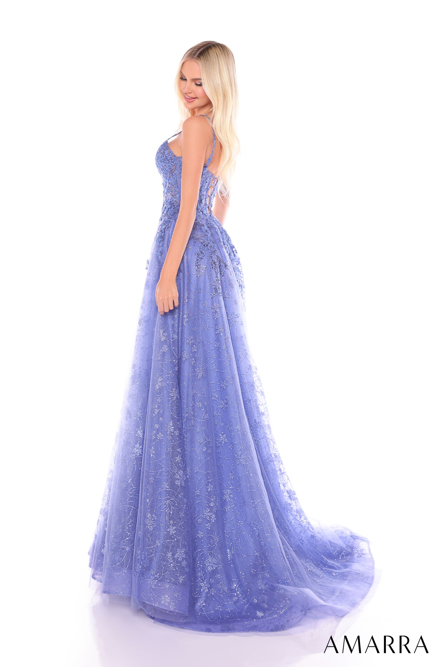 A periwinkle blue, floor-length gown with intricate floral lace detailing and a full, flowing skirt.