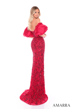 A blonde woman wears a long red sequined gown with voluminous puffy sleeves and a dramatic train.