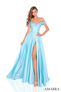 A model wears a turquoise off-shoulder gown with beaded bodice and high slit on white background.