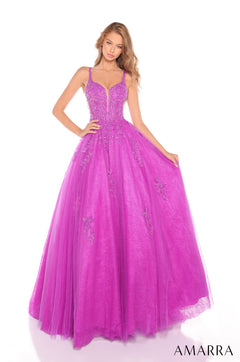 A model wears a magenta ballgown with beaded bodice and full tulle skirt from Amarra.