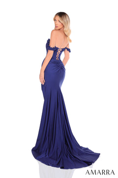 A navy blue off-shoulder mermaid gown with a corset back and dramatic train, worn by a blonde model.