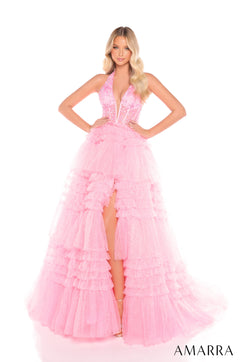 A floor-length Candy Pink tulle gown with a plunging neckline, tiered skirt, and dramatic high slit.