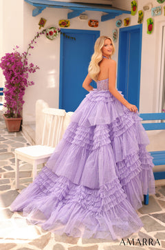 A lavender tulle ball gown with sparkling ruffles stands against a blue-and-white Mediterranean-style backdrop.
