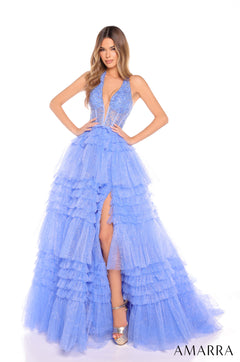 A model wears a periwinkle tiered tulle gown with a plunging neckline and high leg slit.