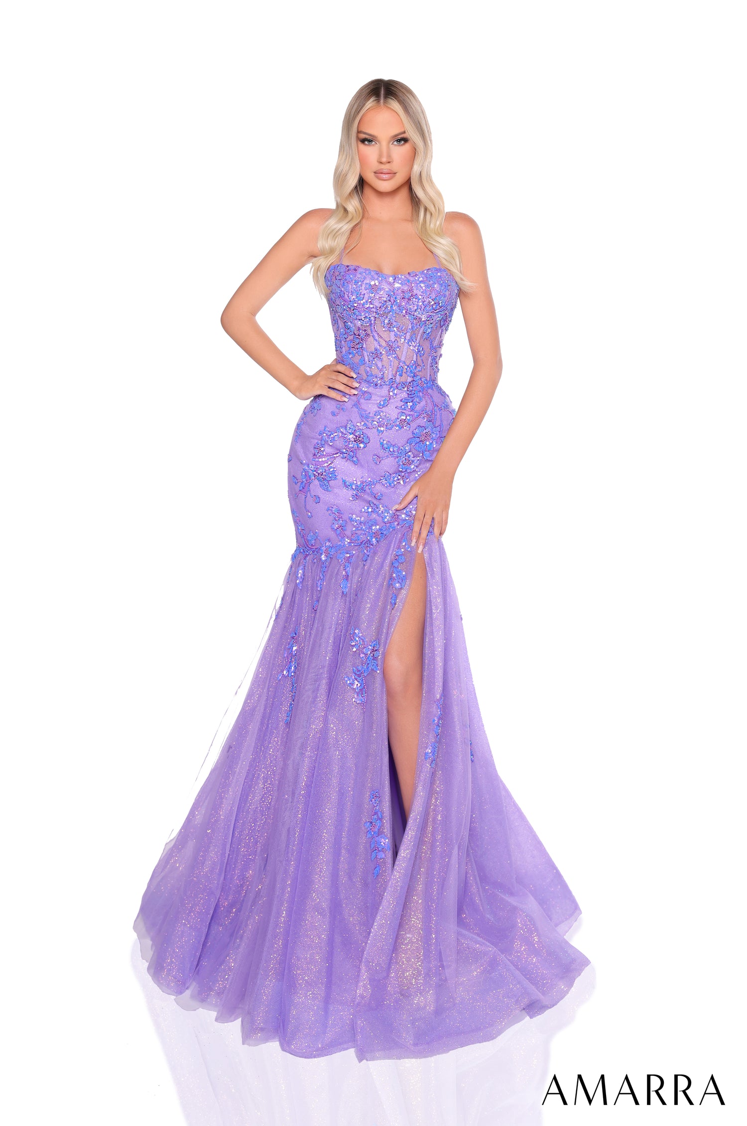 A lilac sequined mermaid gown with a side slit and strapless bodice, displayed on a model against a white background.