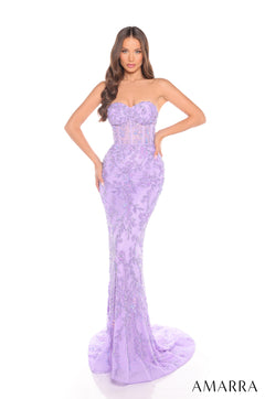 A strapless, form-fitting lilac gown with floral lace overlay and a sweeping train, modeled by a woman.
