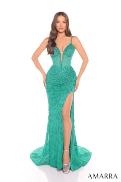A slender model wears a long, shimmering jade gown with a high slit and plunging neckline.
