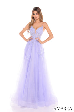 A flowing periwinkle ballgown with a plunging neckline and floral lace bodice stands on a white background.