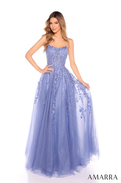 A model wears a strapless, full-length Slate Blue ballgown with intricate lace and tulle detailing.