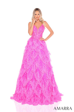 A floor-length Barbie pink ball gown with intricate lace layers and a plunging neckline, worn by a blonde model.