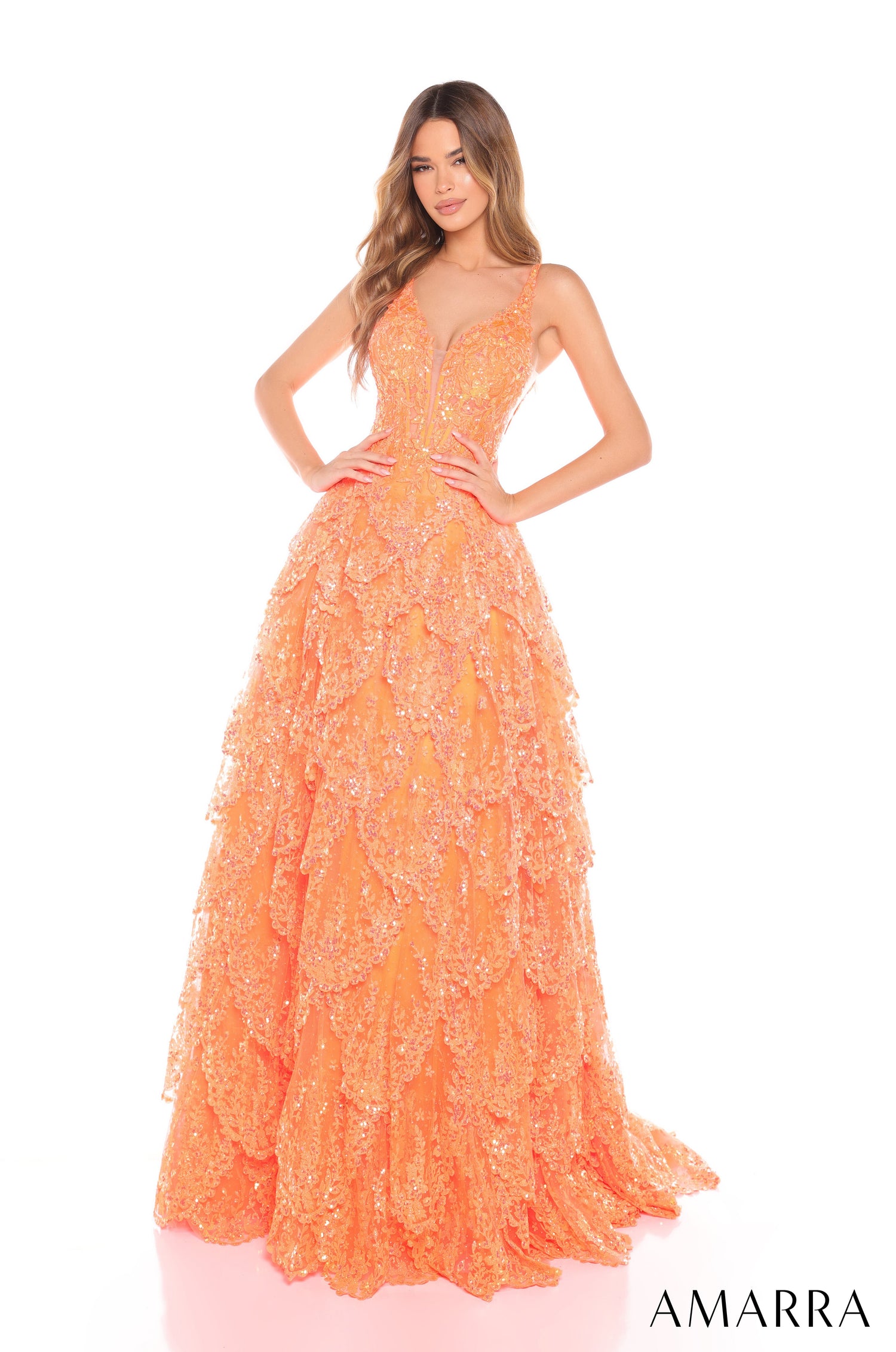 A glamorous, tiered Orange sequin gown with a plunging neckline and full, flowing skirt by Amarra.