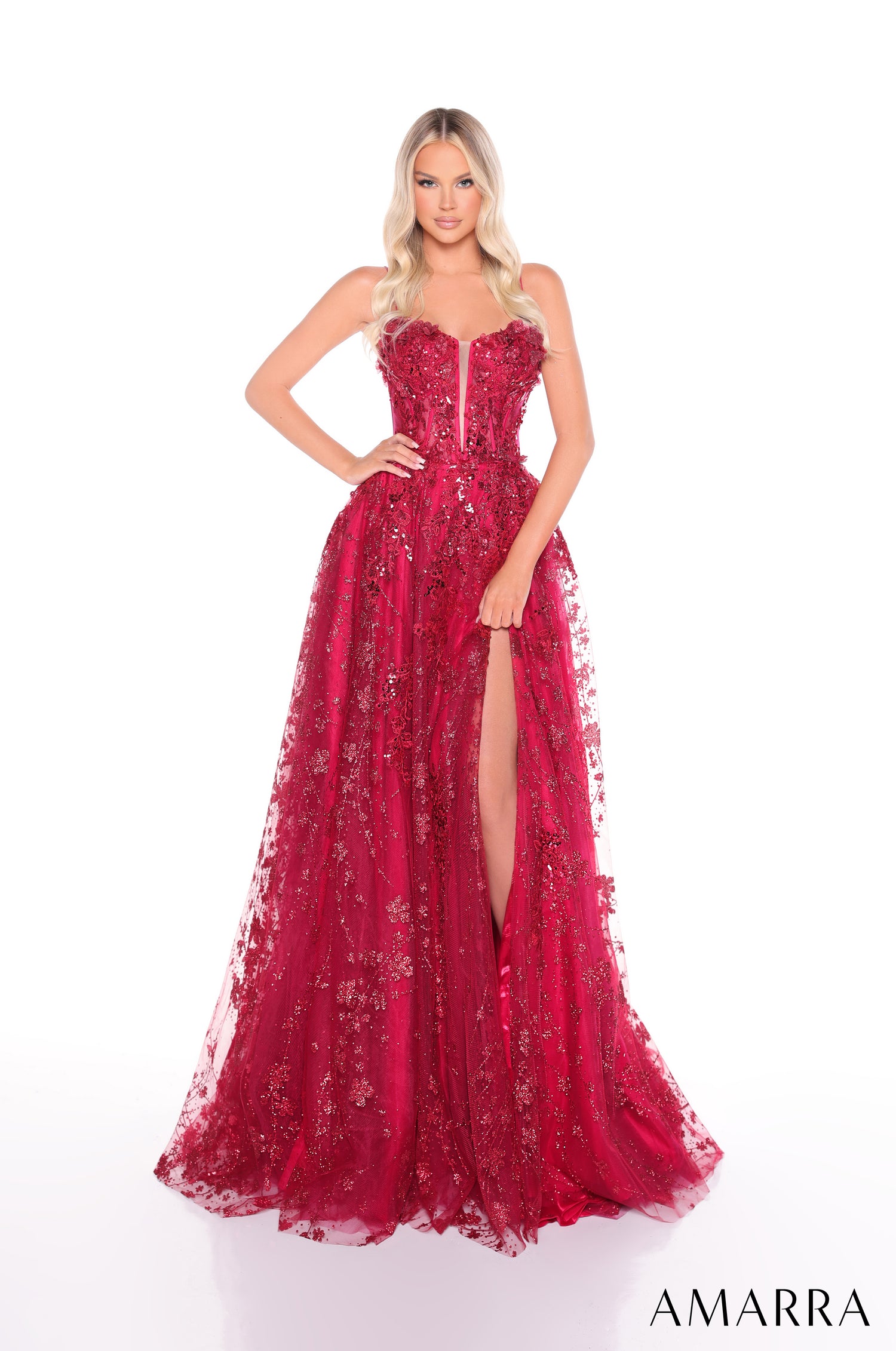 A strapless, wine-colored sequined gown with a high slit and full, flowing tulle skirt.