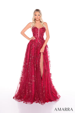 A strapless, wine-colored sequined gown with a high slit and full, flowing tulle skirt.