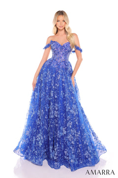 A model wears a Royal Blue floral lace off-shoulder ballgown with a sweetheart neckline and full skirt.
