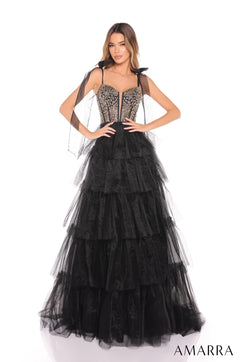 A Black/Gold tiered tulle ball gown with a beaded corset bodice and sweeping ruffled skirt.