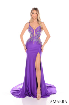 A woman wears a long Purple evening gown with a thigh-high slit and intricate lace bodice by Amarra.
