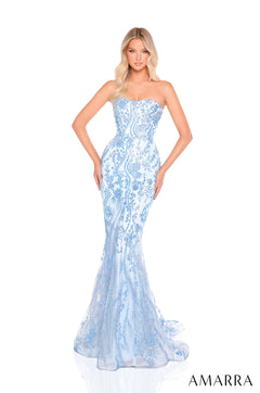 A model wears a strapless, light blue mermaid gown with intricate floral lace and a sweeping train.