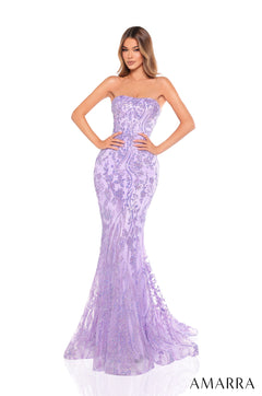 A tall woman wears a strapless, shimmering lilac mermaid gown with an intricate floral lace pattern.