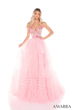 A woman wears a Light Pink/Multi tiered ball gown with a floral embellished bodice and voluminous tulle skirt.