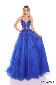 A model wears a Royal Blue ballgown with sequined bodice and full tulle skirt from Amarra.