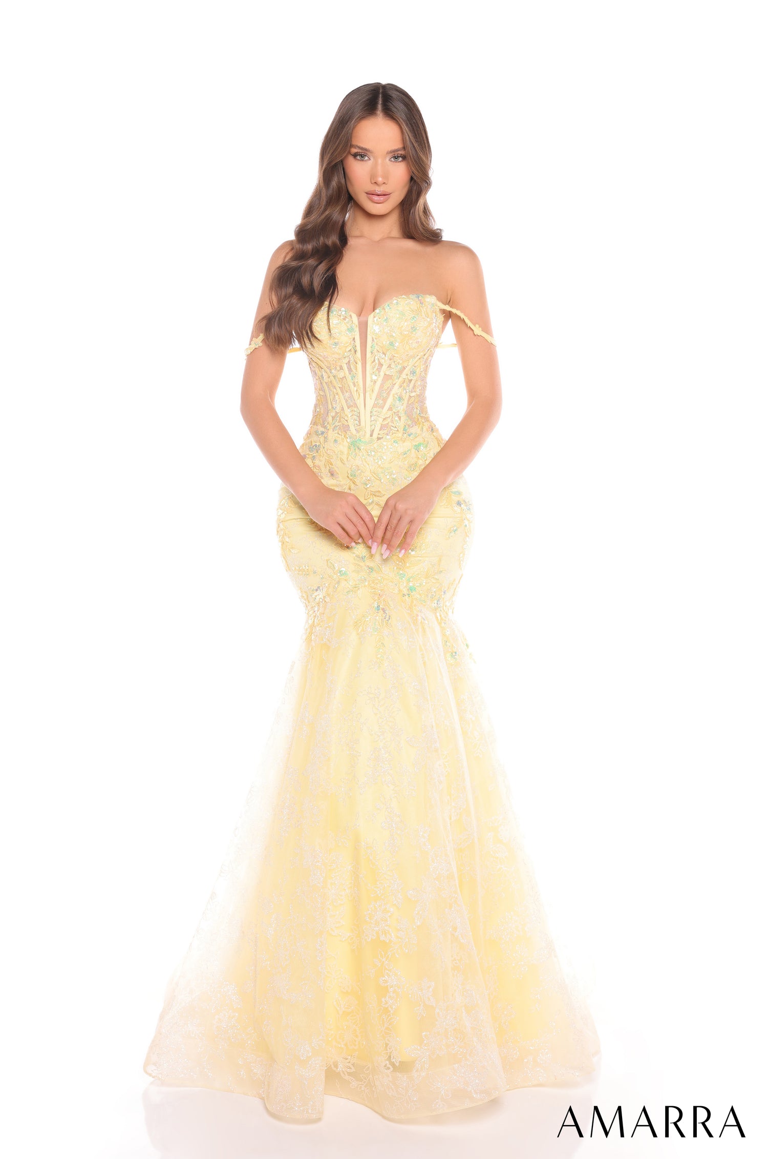 A long, off-shoulder Yellow mermaid gown with intricate lace and sequin embellishments from Amarra.