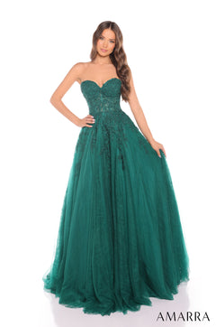 A model wears a strapless emerald green ballgown with an embellished bodice and full tulle skirt by Amarra.