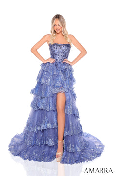 Model wears a multi-tiered, sparkly Slate Blue gown with high slit and strapless bodice from Amarra.