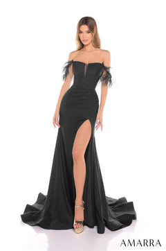 A model wears a black off-shoulder gown with feathered sleeves and a high slit, posing against a white background.